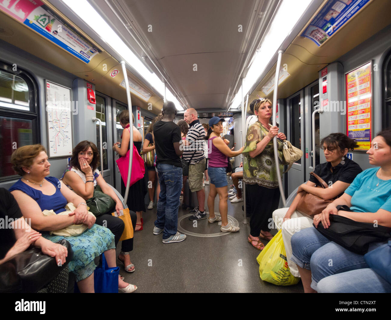 Passengers in an underground tube train, Milan, Italy, Europe Stock Photo