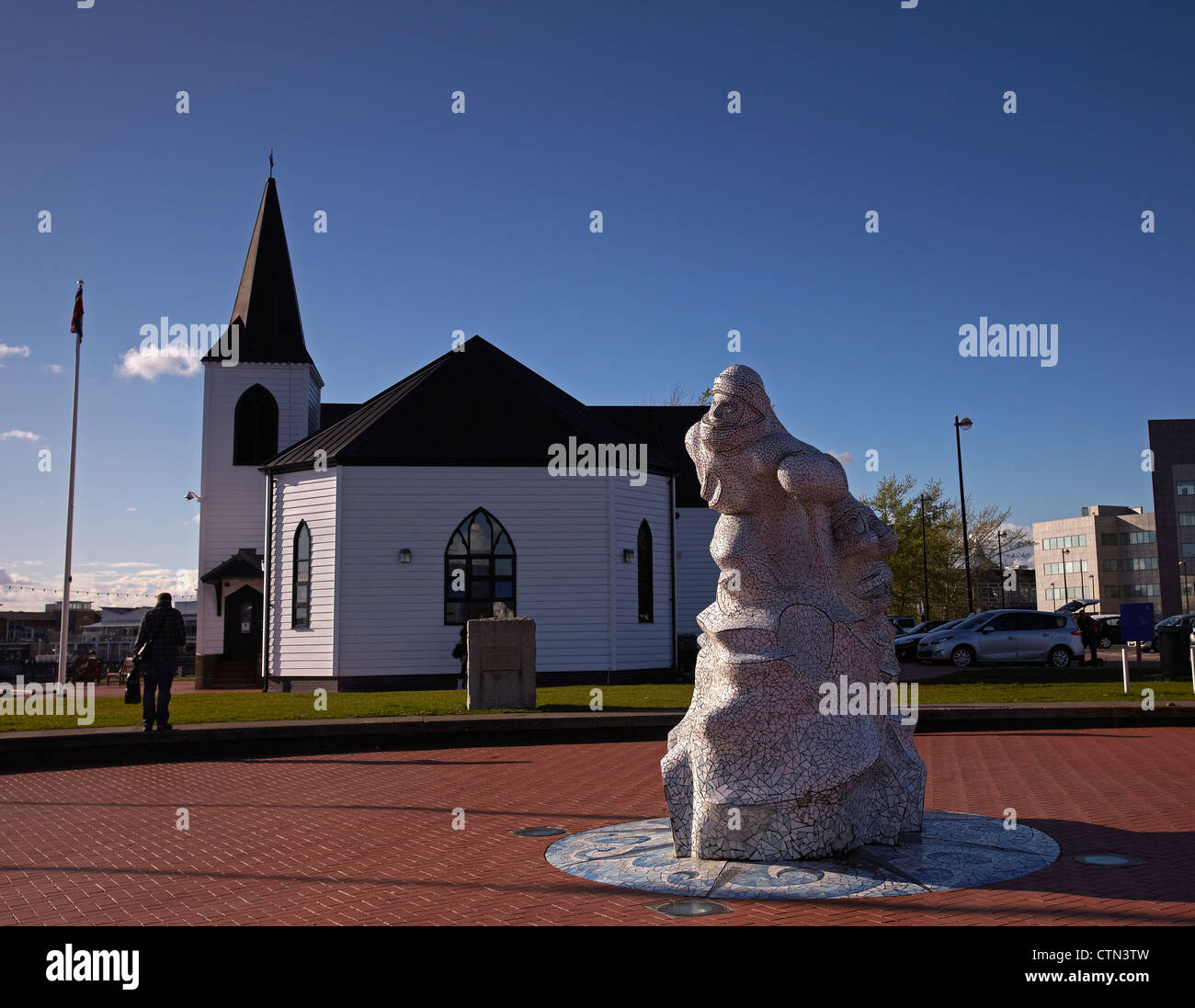 Captain Scot Mosaic sculpture, and the Wooden Norwegian Church, Cardiff Bay, Wales, UK Stock Photo