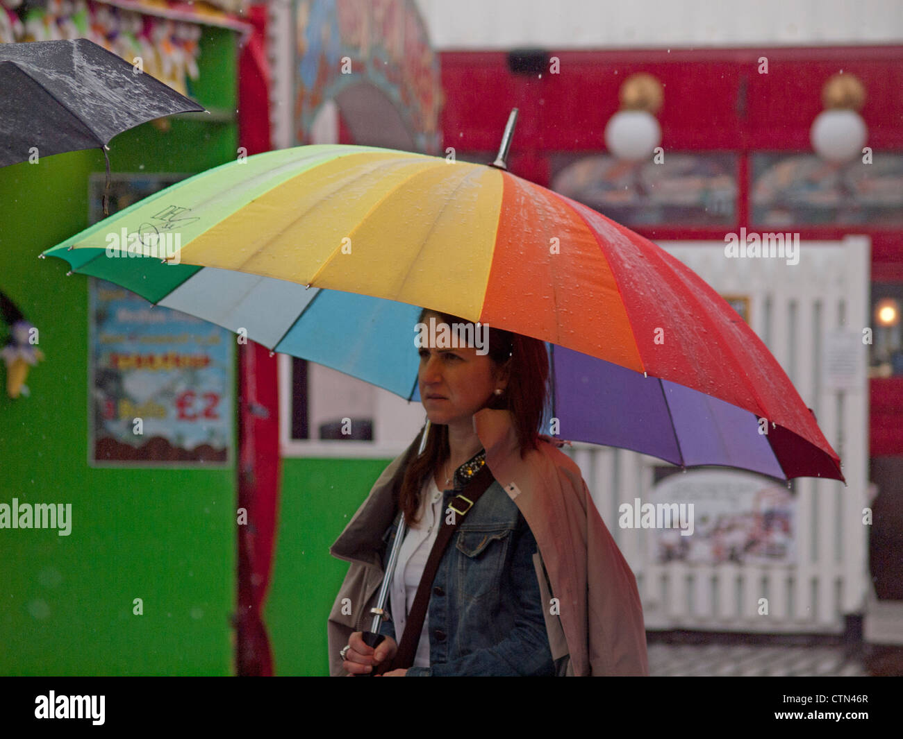 A wet summers day on the pier at Brighton Stock Photo Alamy