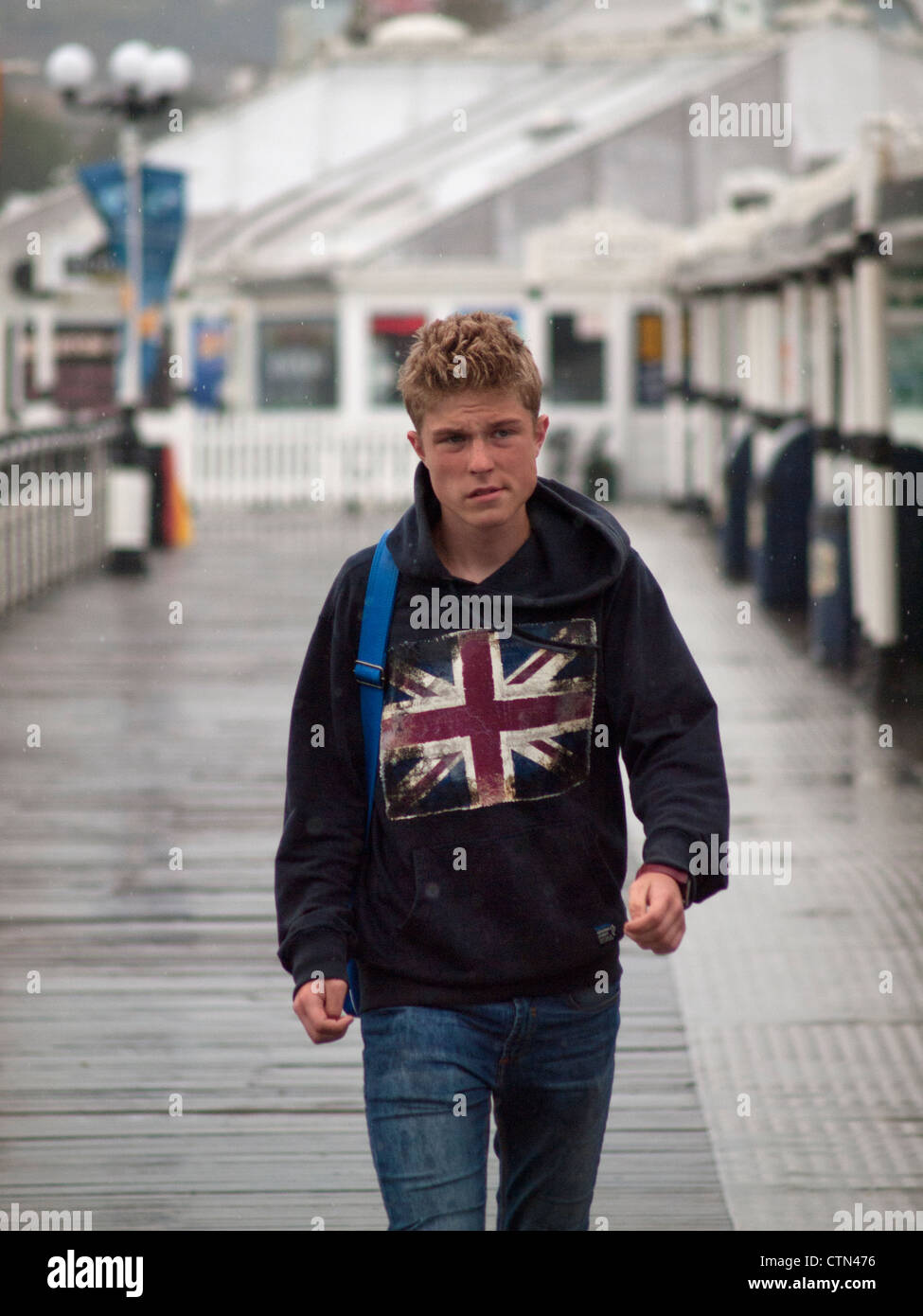 A wet summers day on the pier at Brighton Stock Photo Alamy