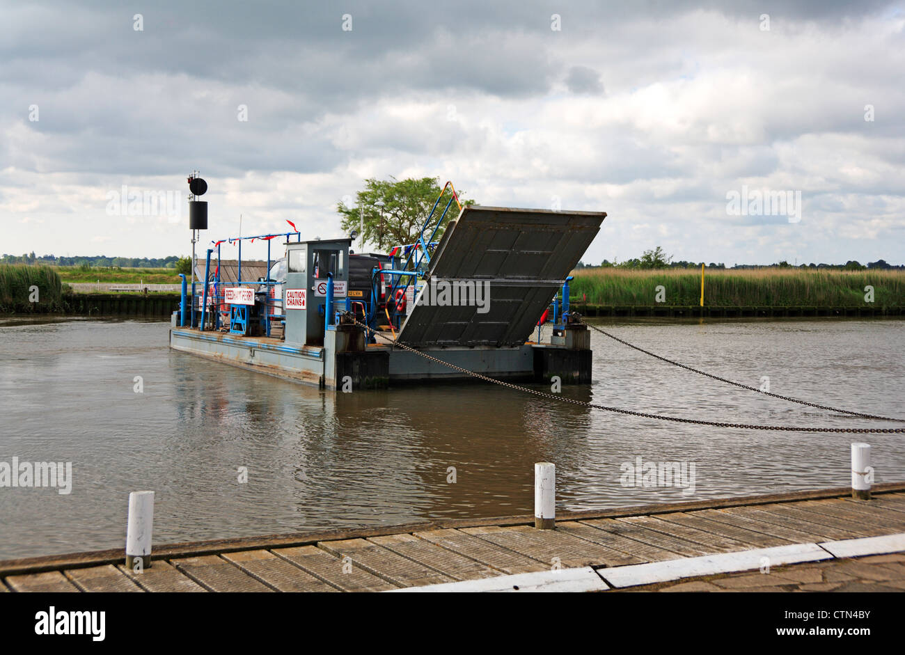 The vehicular ferry crossing the River Yare on the Norfolk Broads at Reedham, Norfolk, England, United Kingdom. Stock Photo