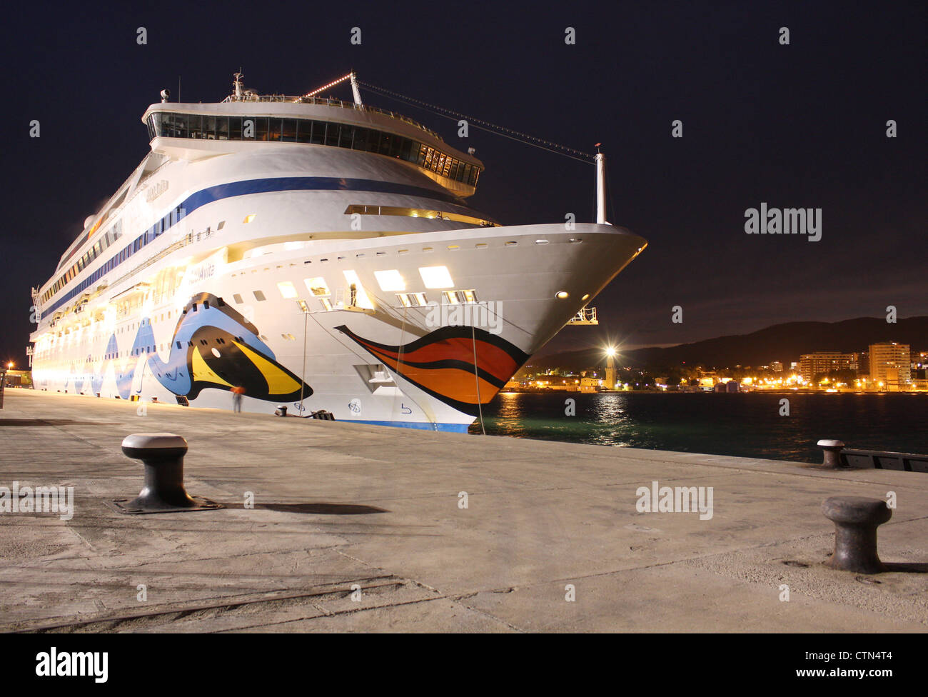 Cruise Ship Aidavita - during night departure from the Port of Palma de Mallorca - mooring lines cast off - Balearic Islands, Sp Stock Photo
