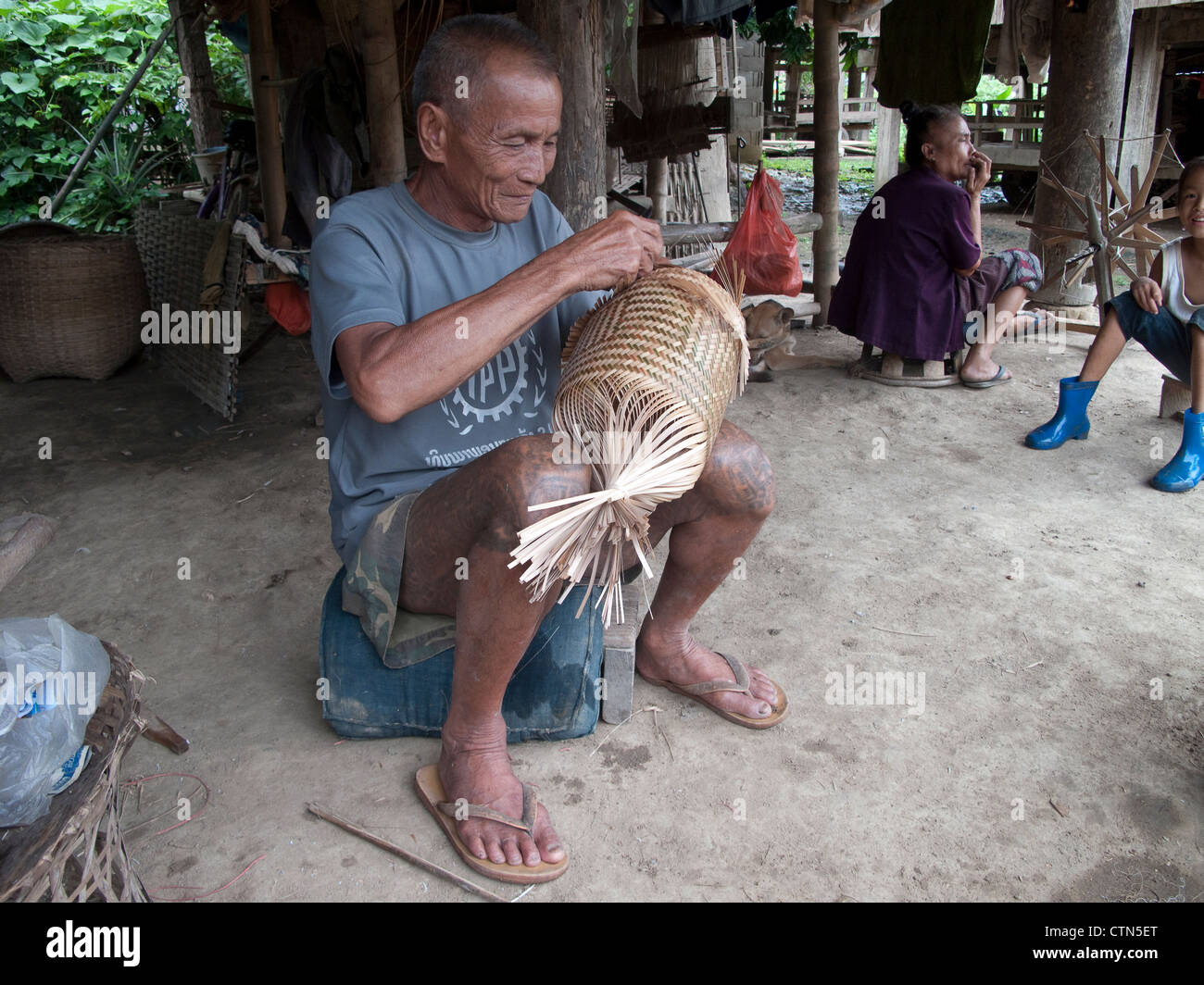Tai Lu 'trouser' tattoos in Northern Laos. The Sak Yan (protection tattoos) tradition in Laos is much diminished. Stock Photo