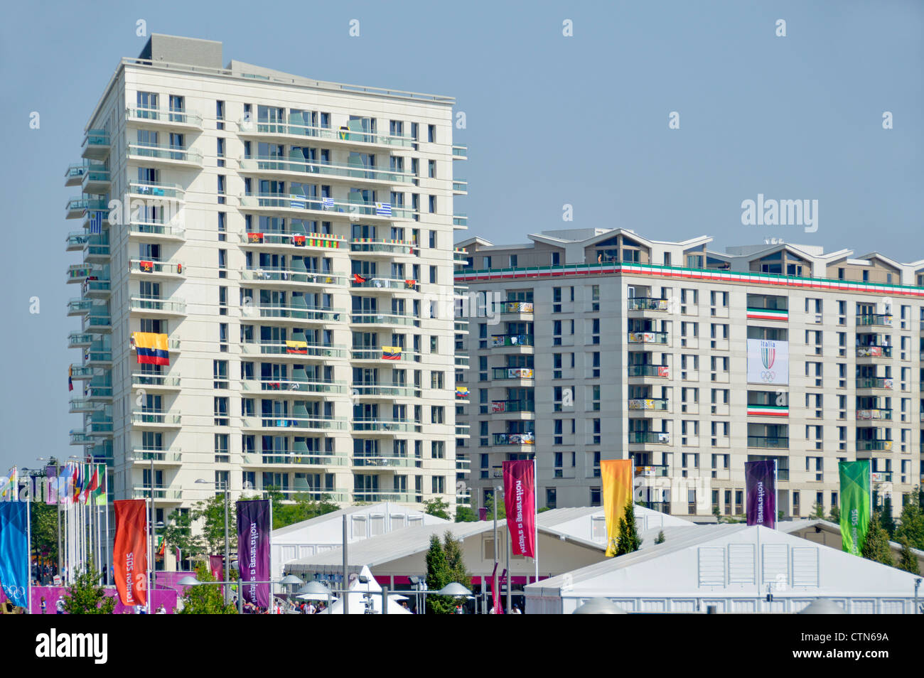 Athletes village and some accomodation blocks seen beyond security fencing at the London 2012 Olympic Park Stock Photo
