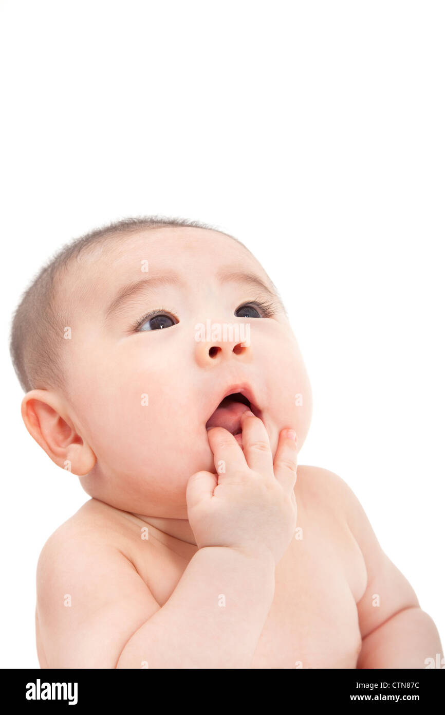 asian baby looking something and thinking Stock Photo