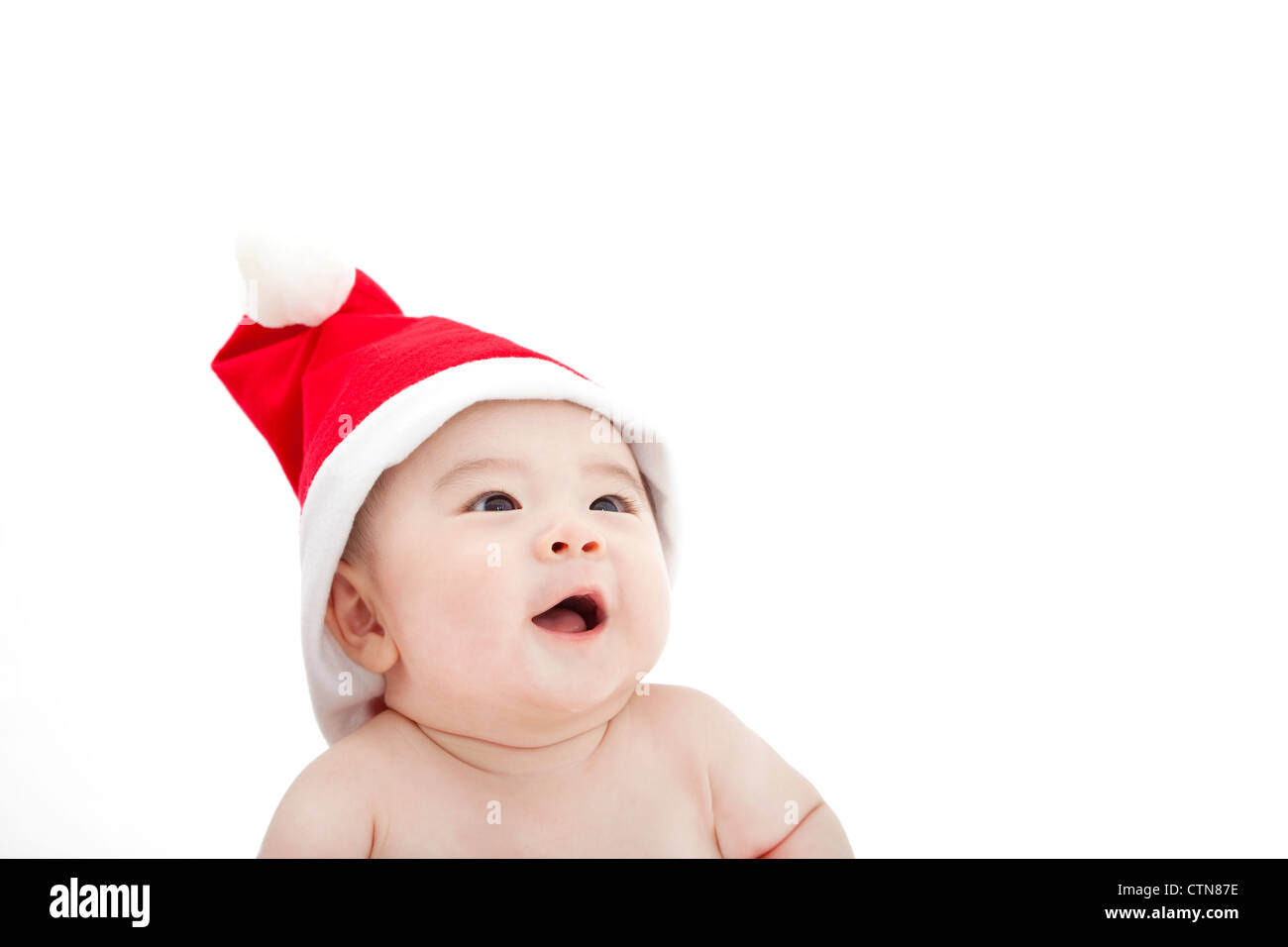 sweet baby in christmas hat Stock Photo