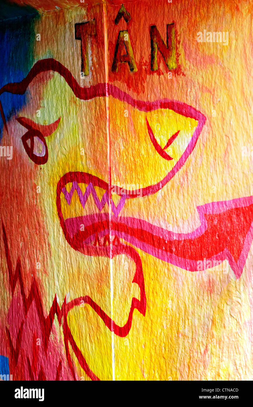 Wall graffiti depicting a Welsh Fire Dragon, with Tan,the welsh word for fire written above it