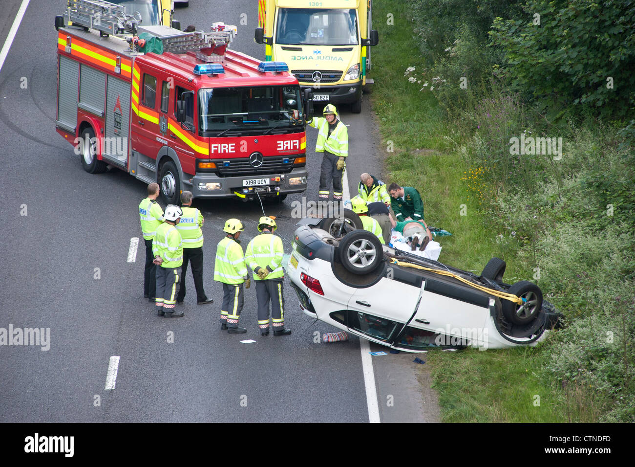 Accident scene on the A30 dual carriageway in Cornwall, where a car has overturned and the road blocked by emergency services Stock Photo