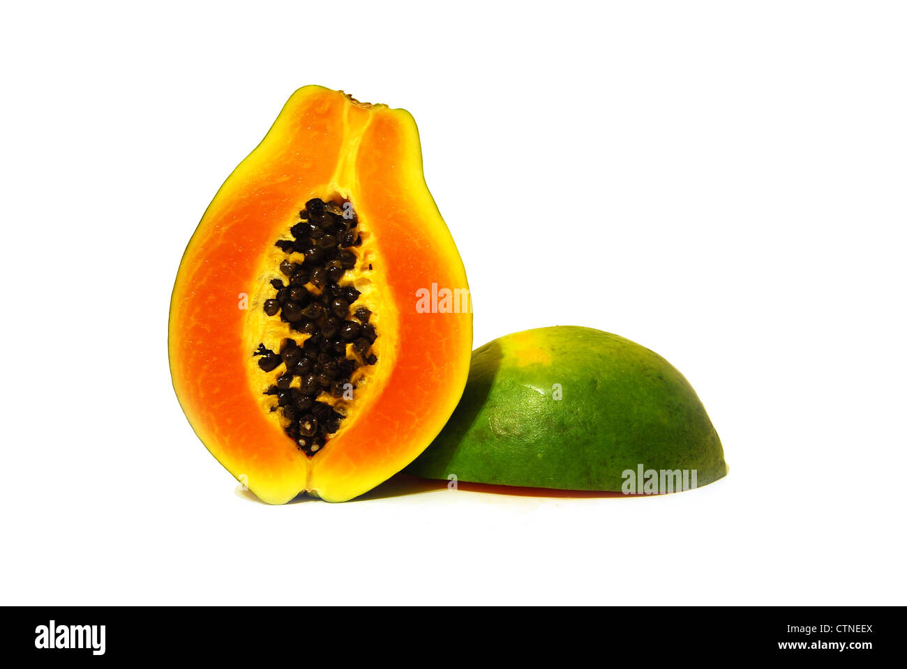 two nice tasty halves of papaya on white background Stock Photo