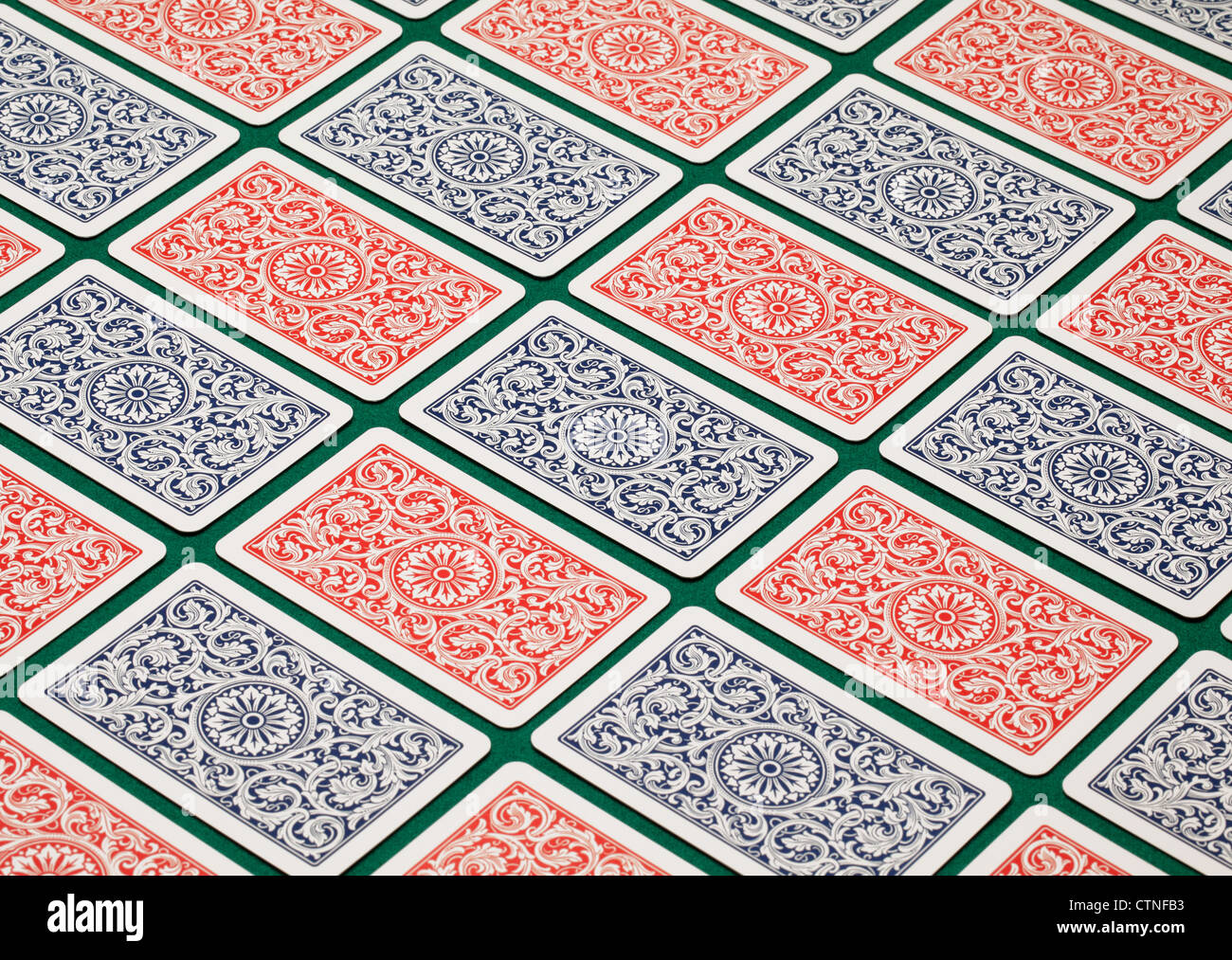 Playing cards on a green table. Stock Photo