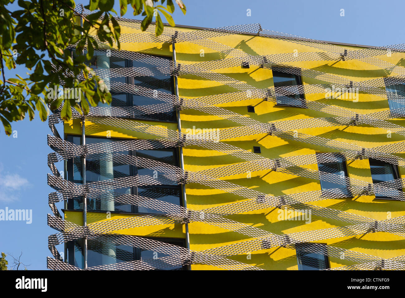 Yellow building with metal lattice in Hackney, London, United Kingdom Stock Photo