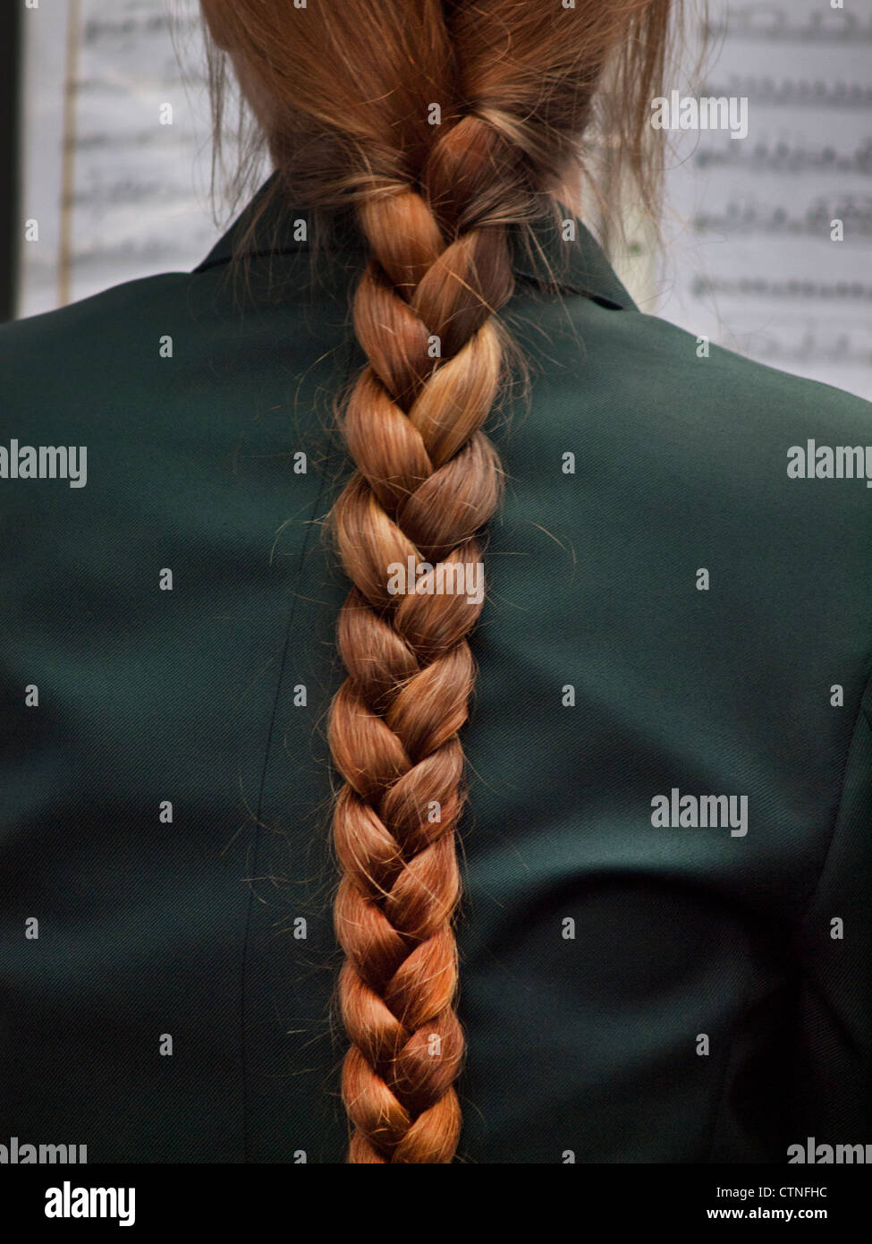 A strong plait of hair hangs down a girls back Stock Photo - Alamy