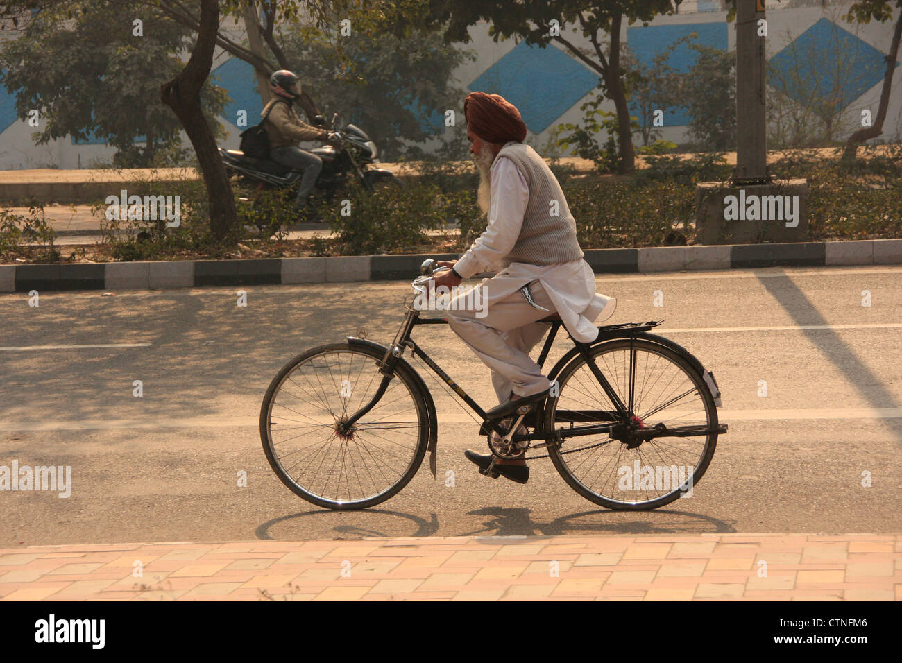 Old indian man on a bicycle Stock Photo