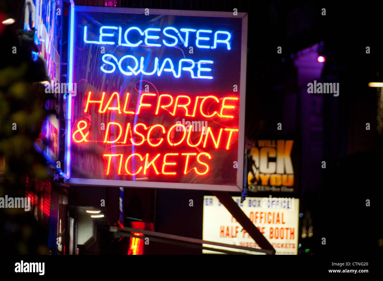 Leicester Square half price tickets neon sign at night with other lit