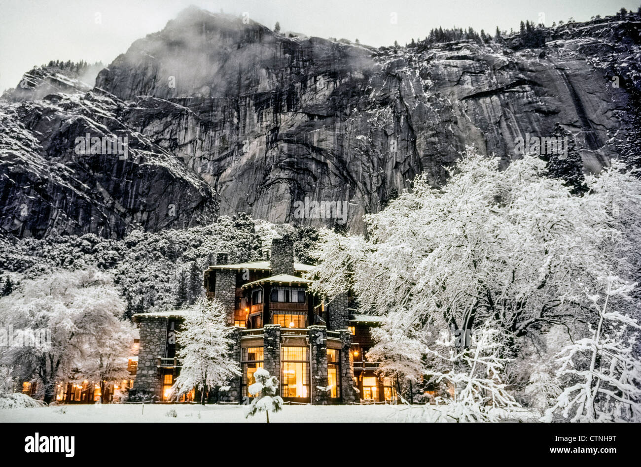 The glow of electric lights inside the historic 1927 Ahwahnee Hotel