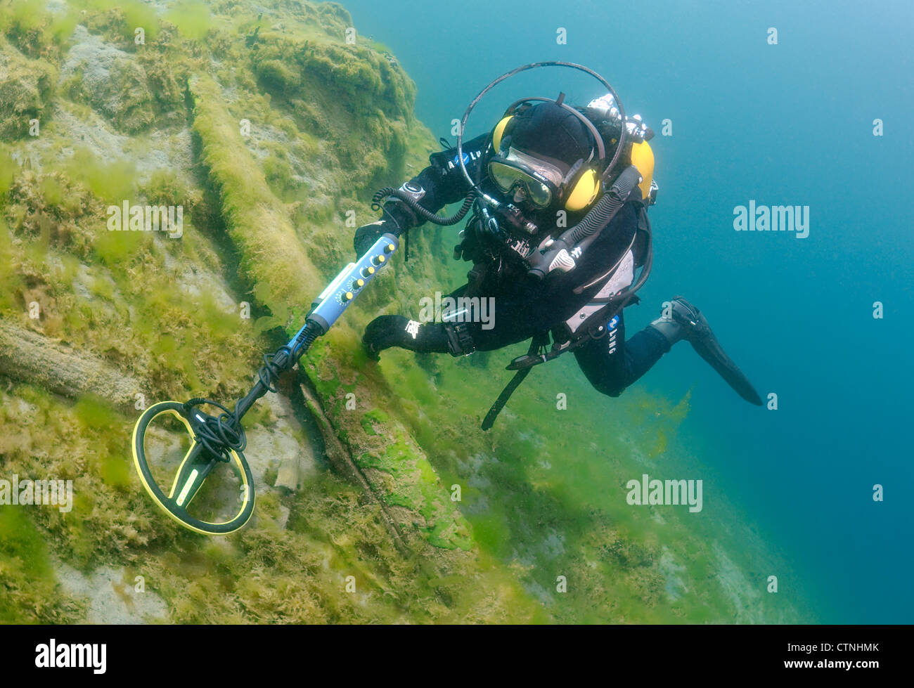 Diver with the metal detector searching for underwater treasure , lake Baikal, Siberia, Russia, Eurasia Stock Photo