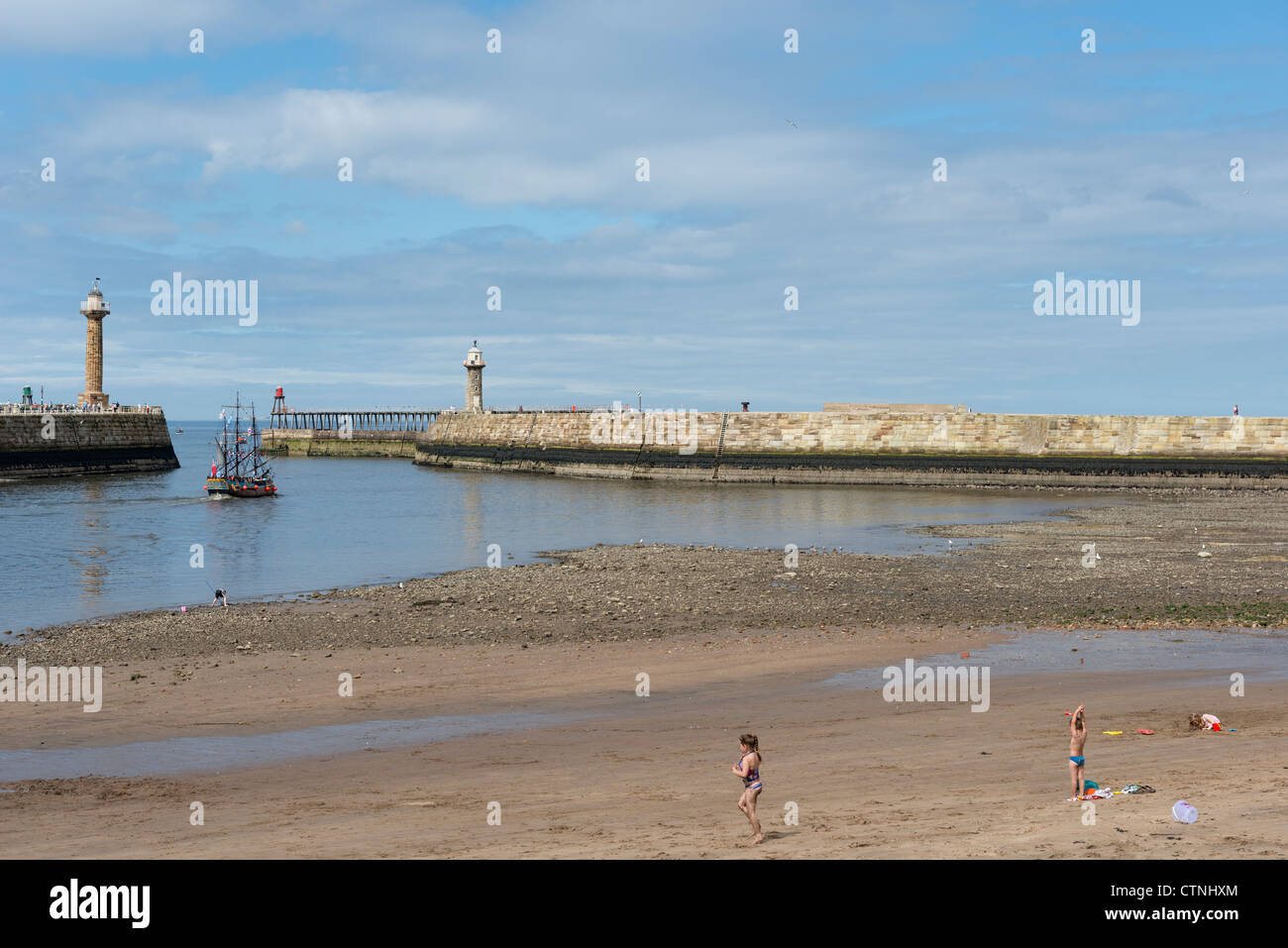 Tate Hill Beach and East and West Piers Whitby Stock Photo