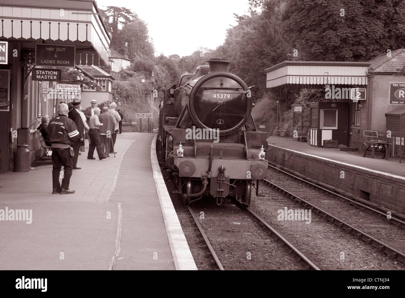 Stream Train at Alresford - Mid Hants Railway on Watercress Line; Hampshire; England; UK in Black and White Sepia Tone Stock Photo