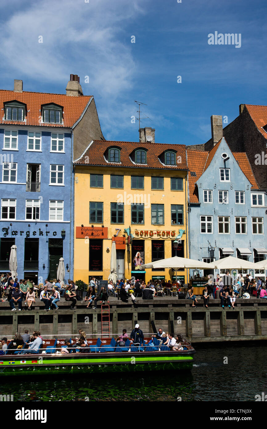 Nyhavn in Copenhagen is a popular recreative area during the summer ...