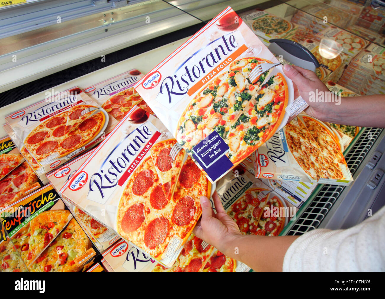 Shopping in a large supermarket. Deep frozen pizza. Stock Photo