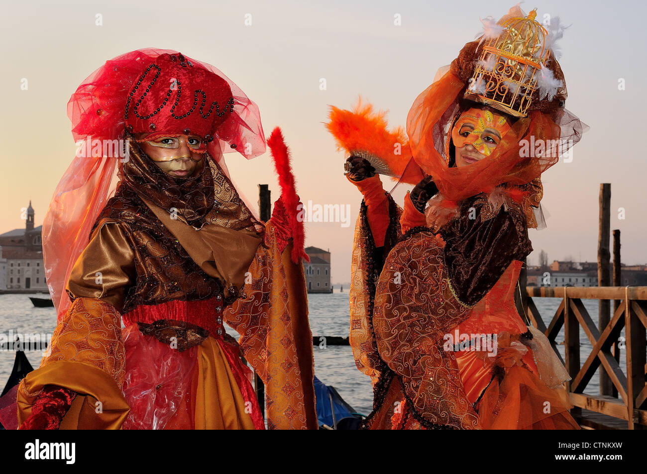 Masked participant during Carnival at sunrise in Piaza San Marco [St. Mark's Square], Venice Stock Photo