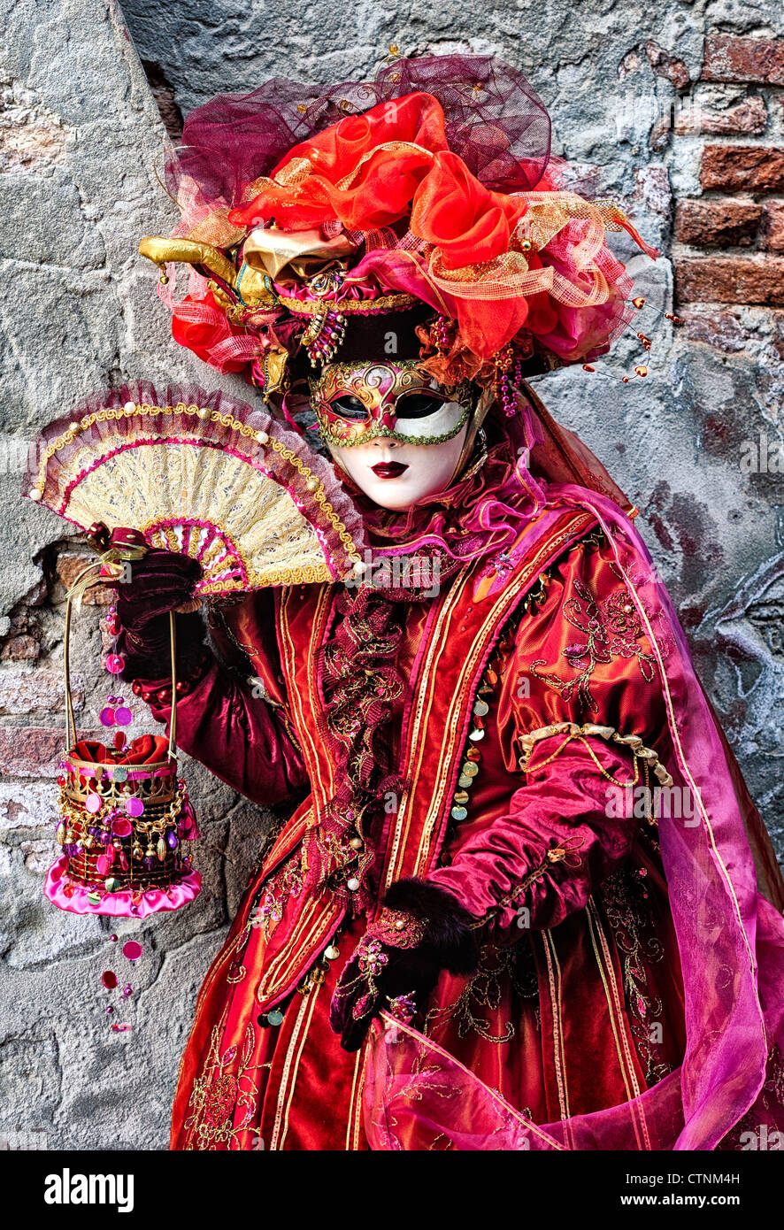 Masked participant during Carnival on Burano Island, Venice Stock Photo