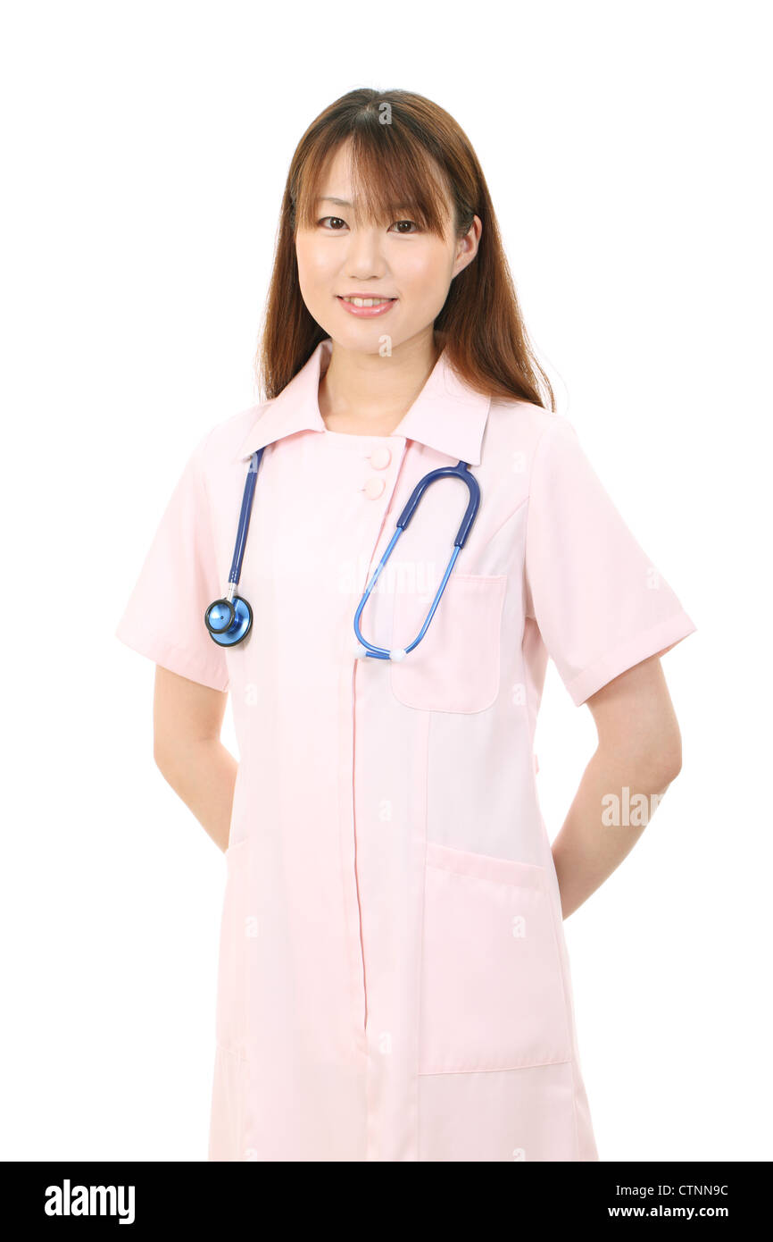 Medical doctor with a stethoscope and hands behind his back Stock Photo -  Alamy