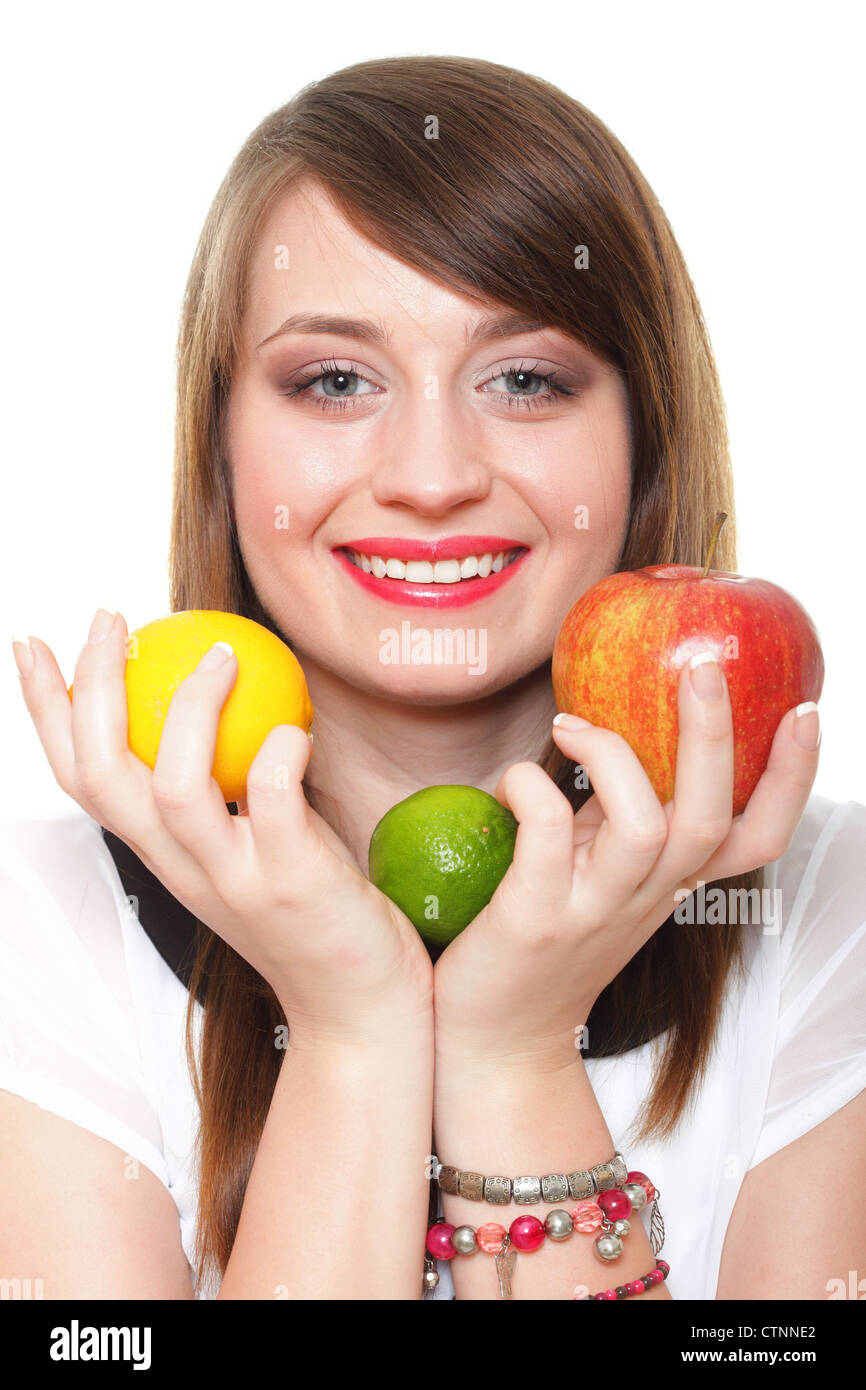 Young smiling woman with fruits and vegetables. Over white background ...