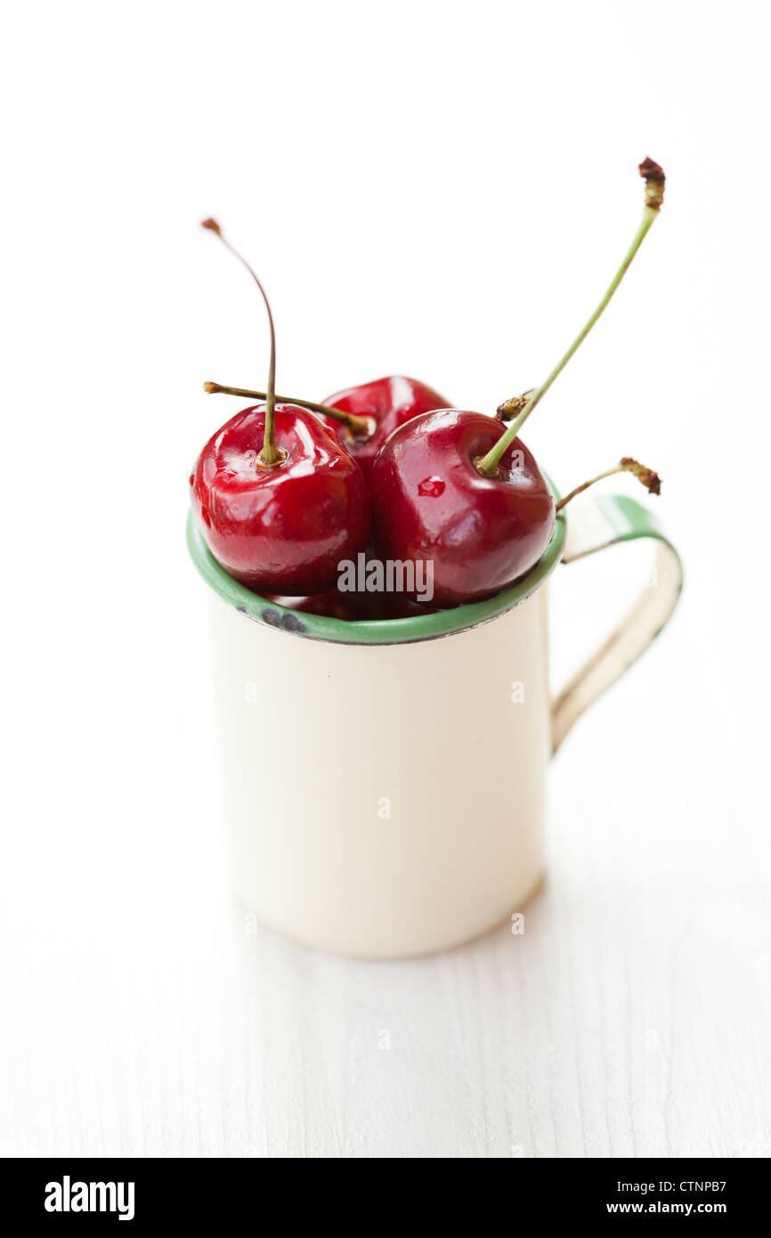 Close-up of fresh delicious and ripe cherries in a cup Stock Photo - Alamy