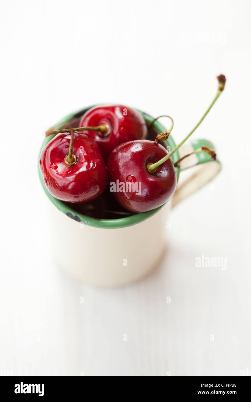 Close-up of fresh delicious and ripe cherries in a cup Stock Photo - Alamy