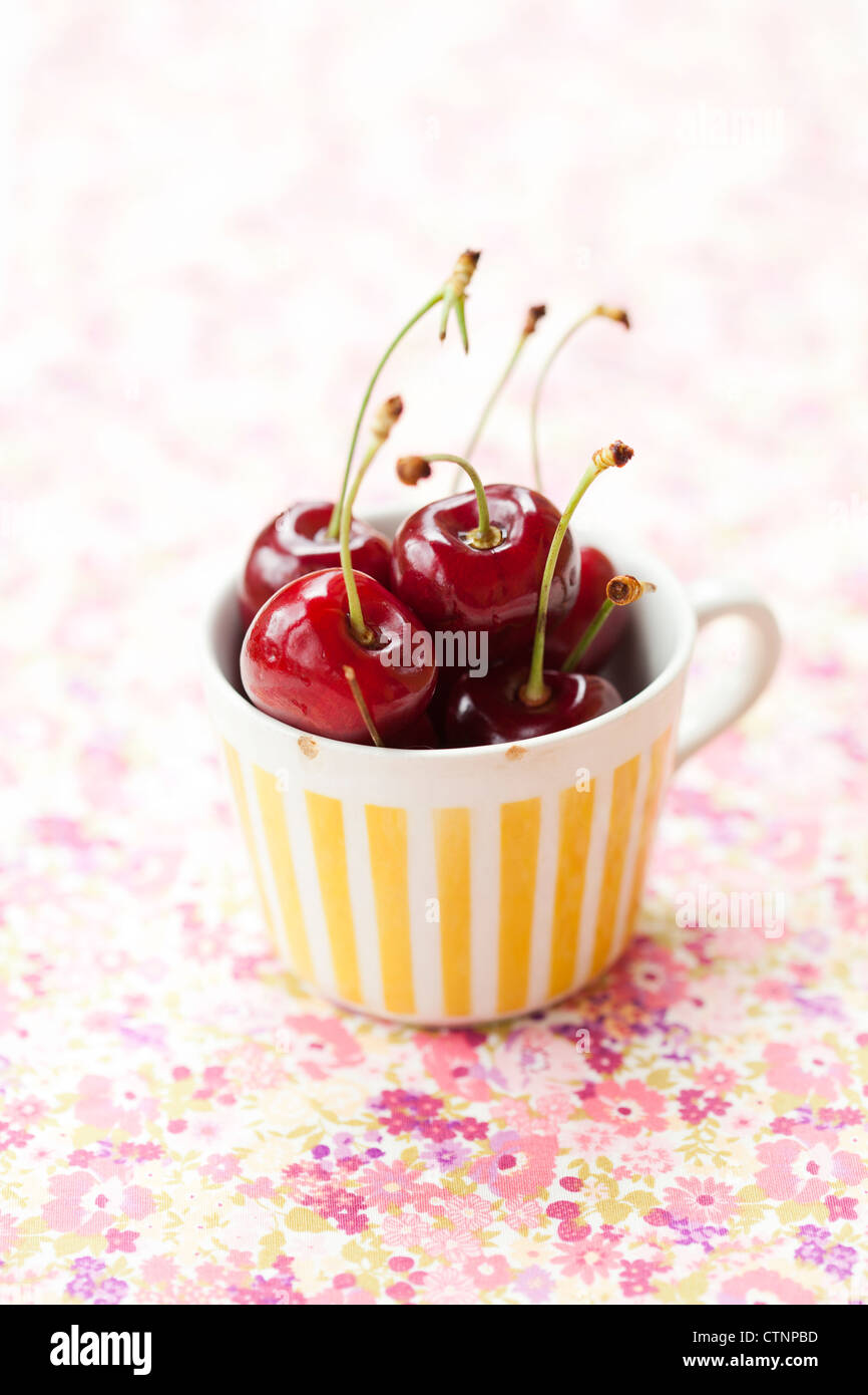 Close-up of fresh delicious and ripe cherries in a cup Stock Photo - Alamy