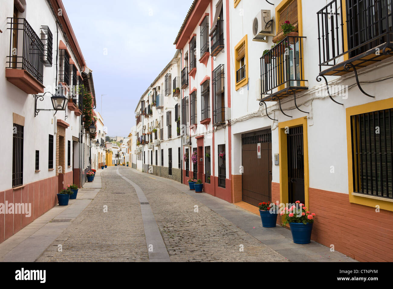 Traditional residential architecture on a tranquil scenic street in the Old Town of Cordoba in Andalusia, Spain. Stock Photo