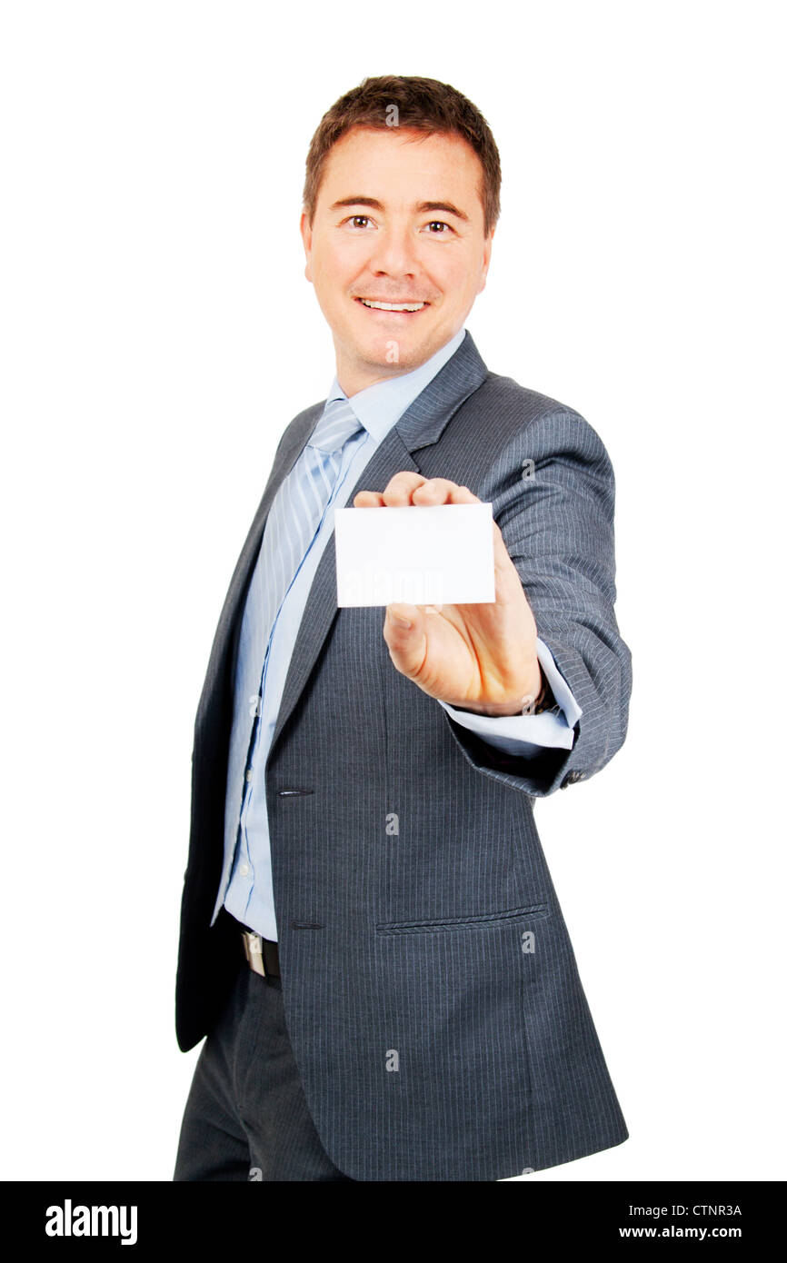 Confident young man holding blank copy space business card on isolated background Stock Photo