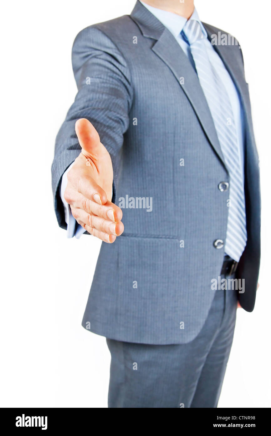 Business person extending hand to shake on greeting or deal Stock Photo