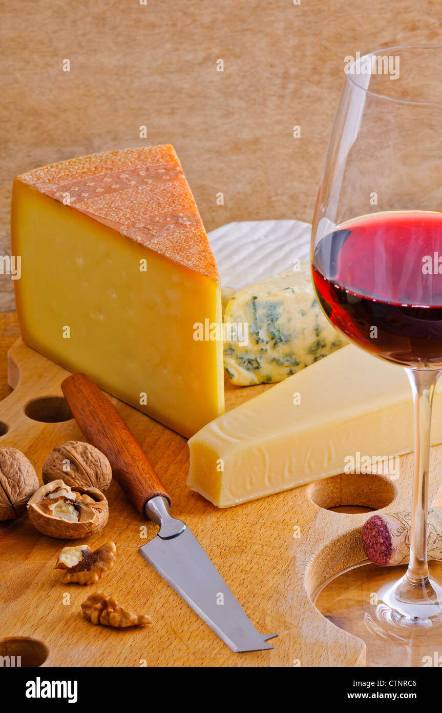 Still life with red wineglass and cheese plate Stock Photo - Alamy