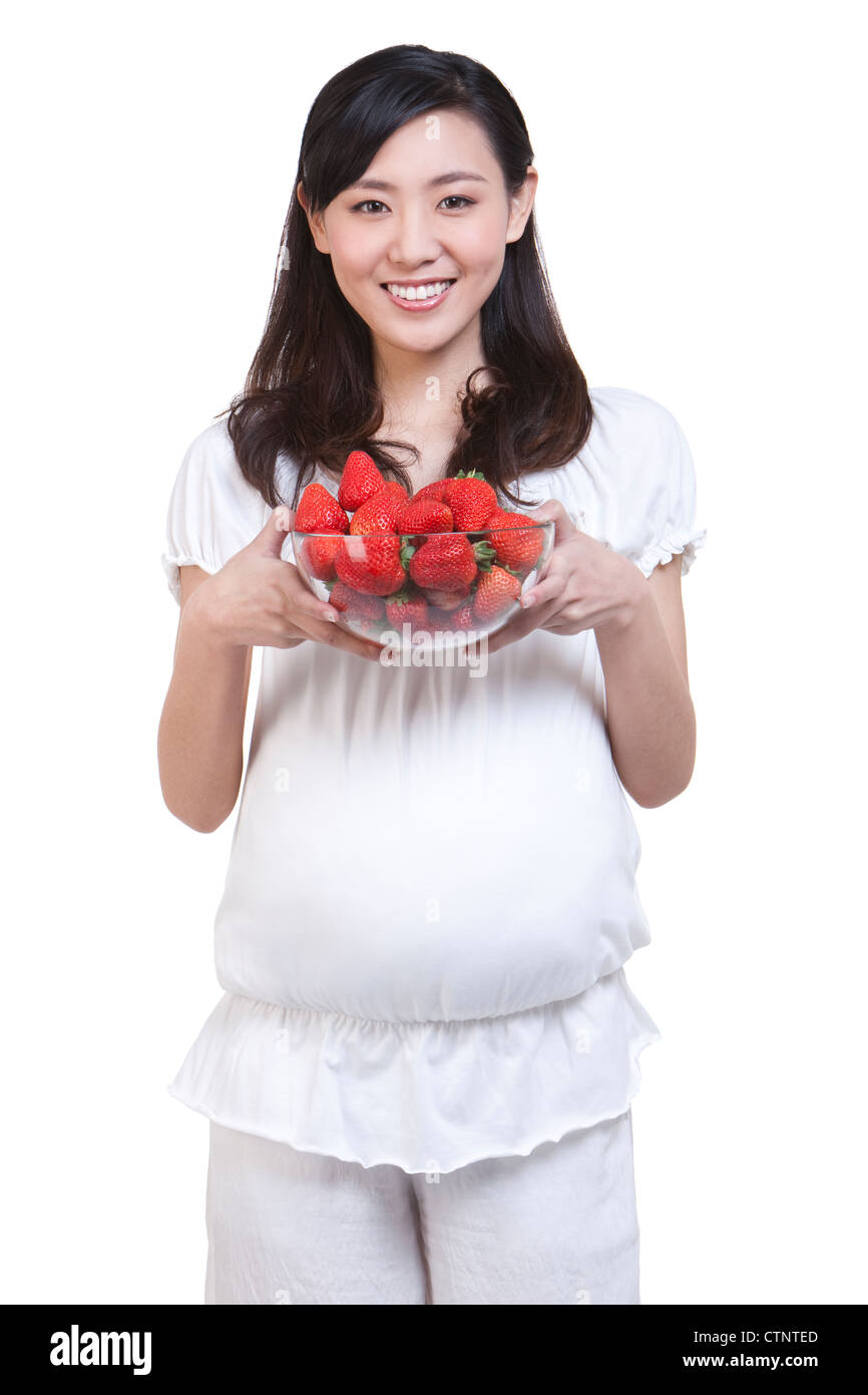 Pregnant woman with fresh strawberries Stock Photo Alamy