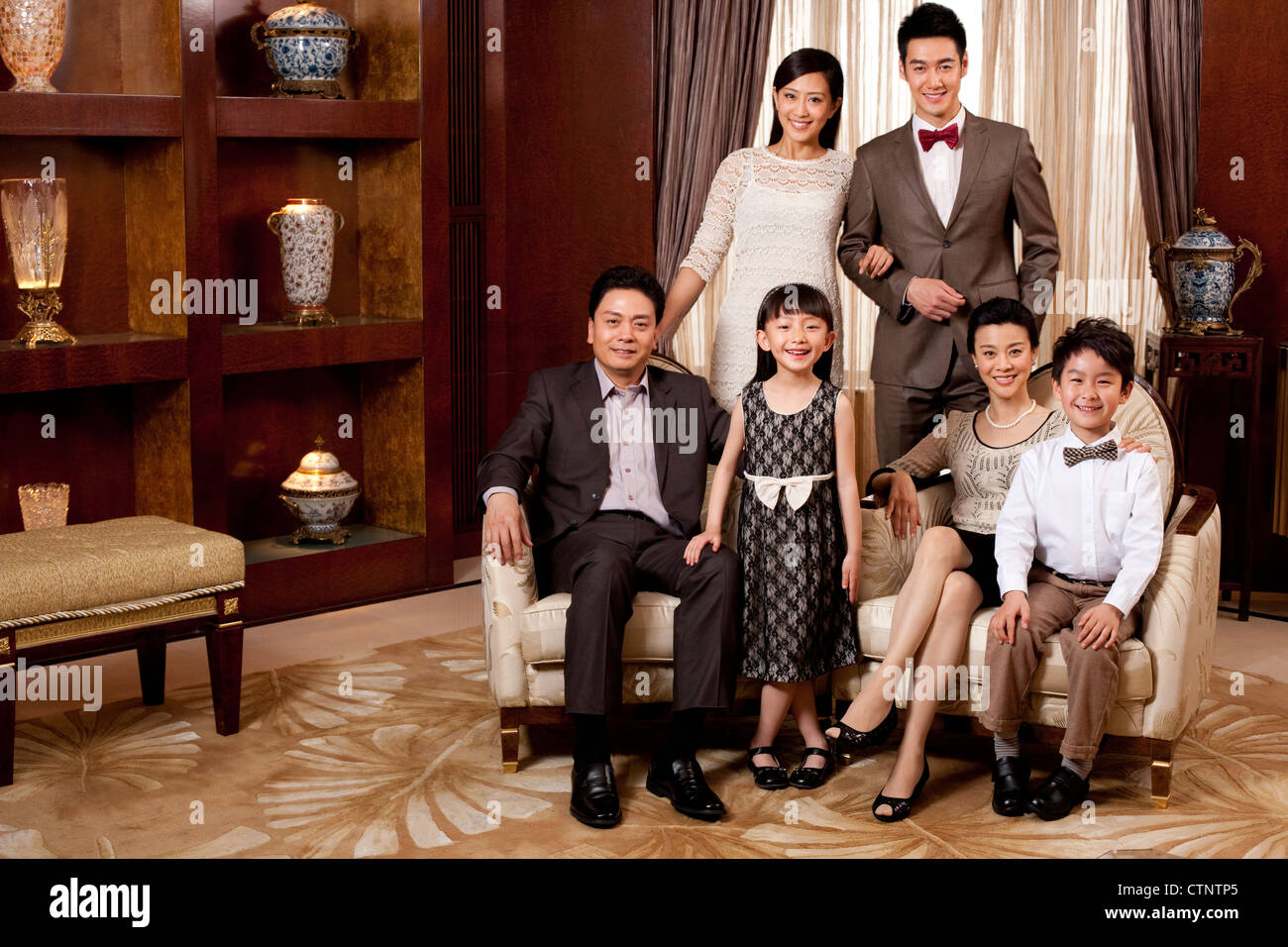 Portrait of a big family in a luxurious room Stock Photo - Alamy