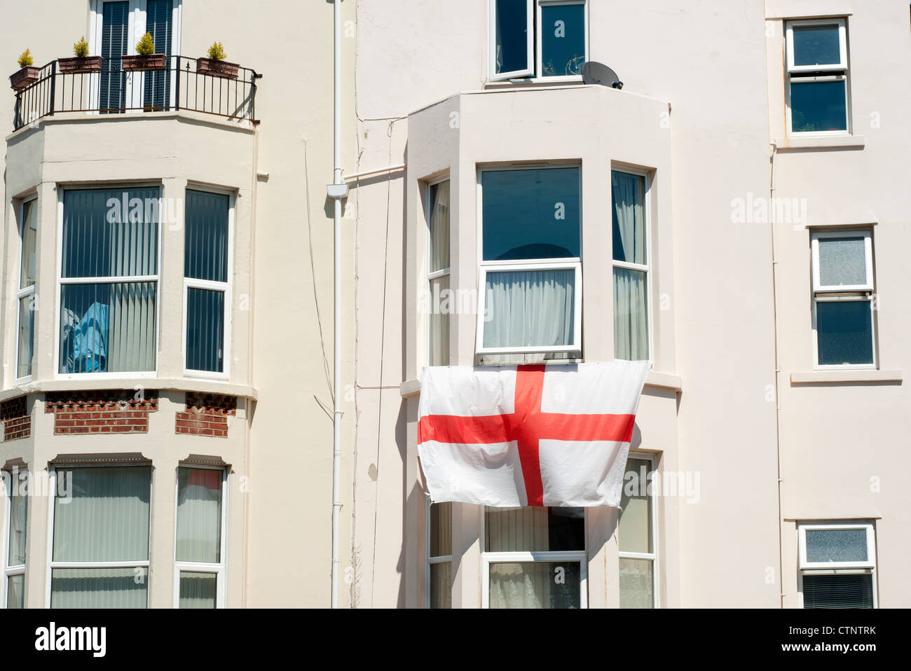 England flag hanging from window hires stock photography and images