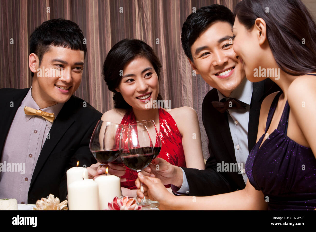 Young people having dinner Stock Photo - Alamy