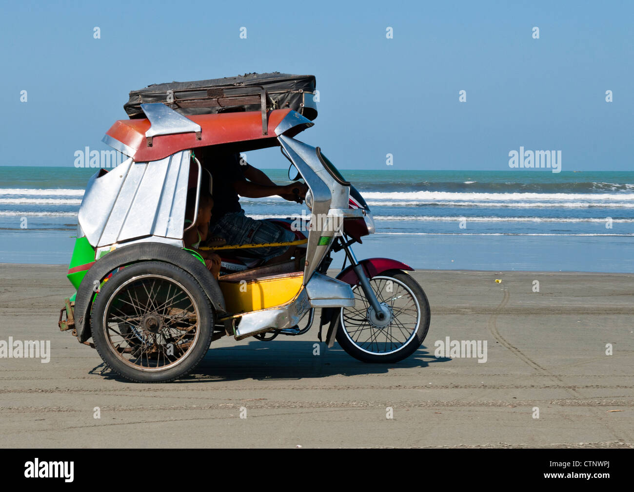 Tricycle on the beach, Lingayen, Philippines Stock Photo
