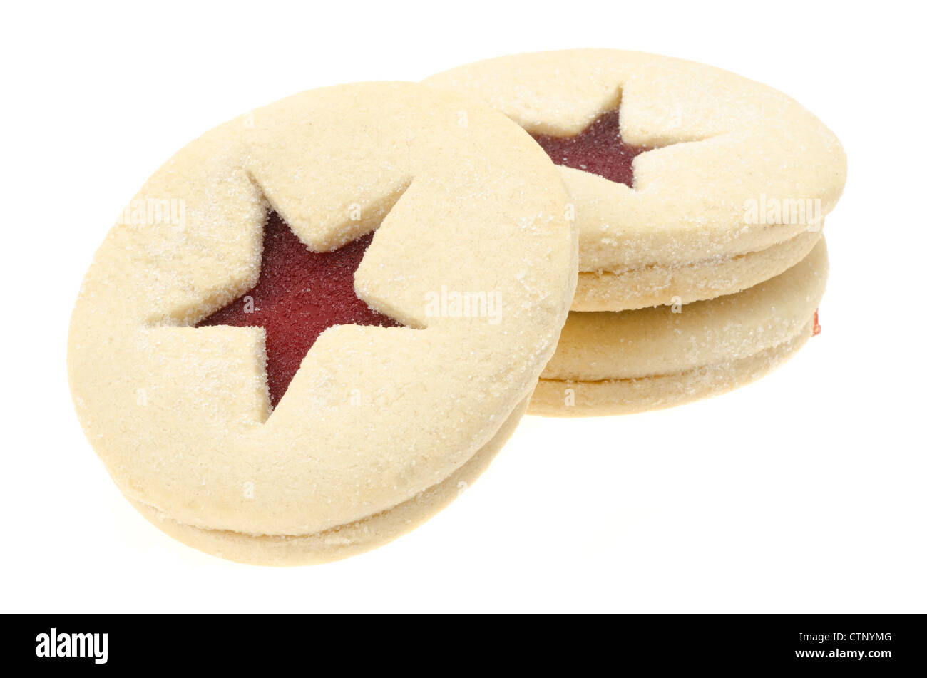 Three Linzer tarts with a jam centre, shallow depth of field - studio shot with a white background Stock Photo