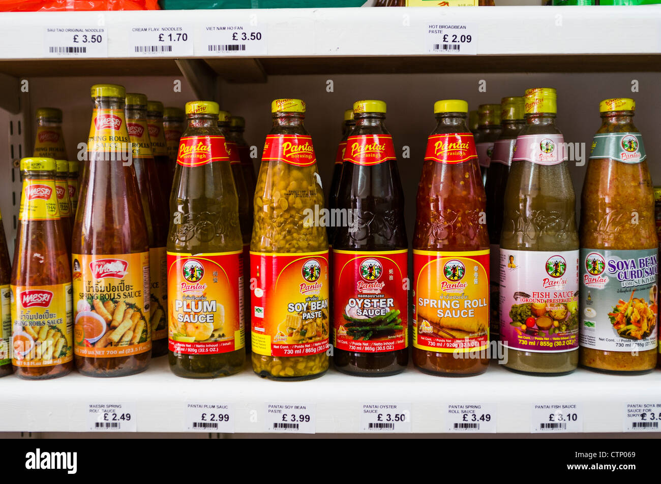 Bottles and jars of imported Asian sauces and pastes at a delicatessen