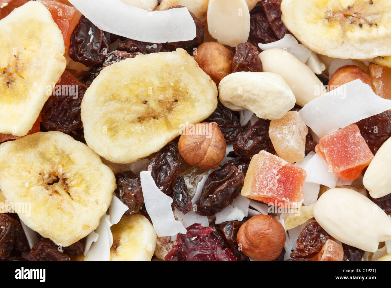 Mix of nuts and dried fruit pieces healthy high energy snack for hikers close-up Stock Photo