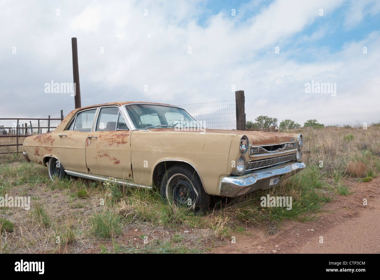 An old Ford Fairlane sits in a vacant lot in the mostly uninhabited rural town of Taiban, New Mexico. Stock Photo
