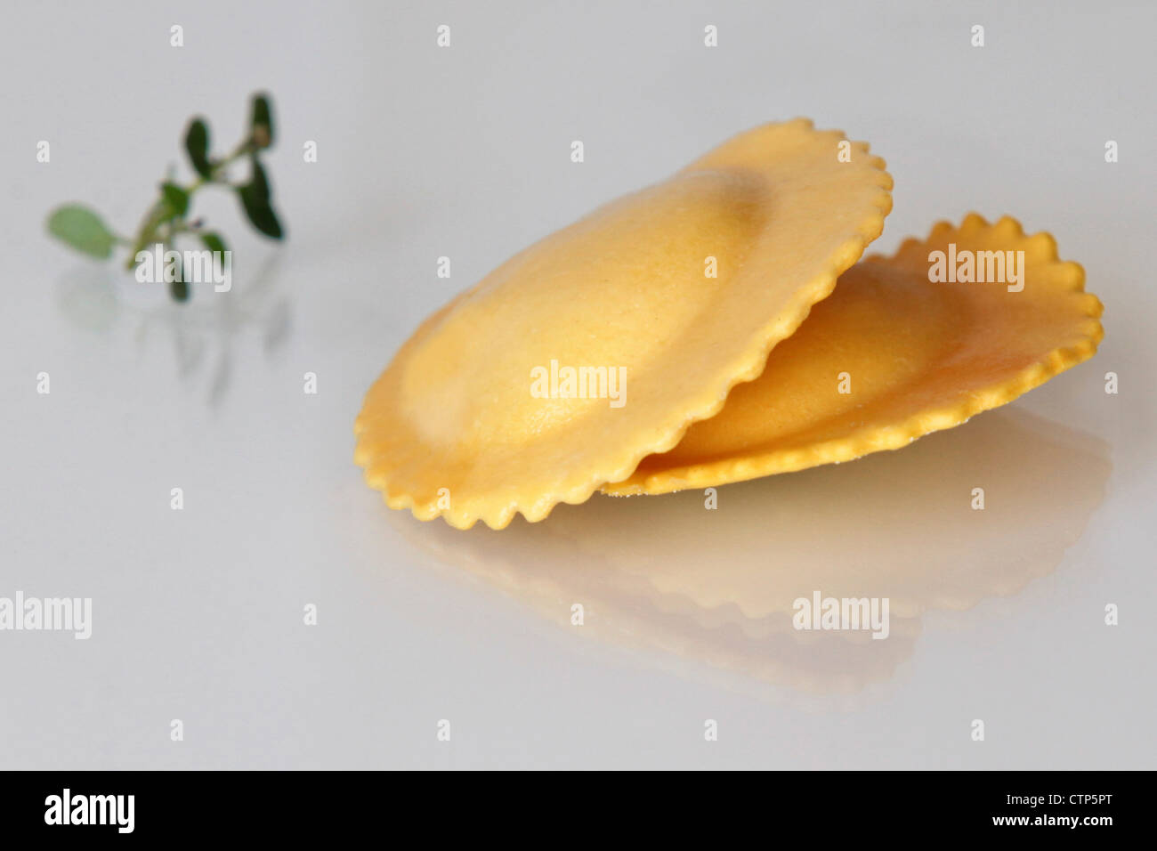 Fresh uncooked Ravioli (Stuffed Pasta) on white background Stock Photo