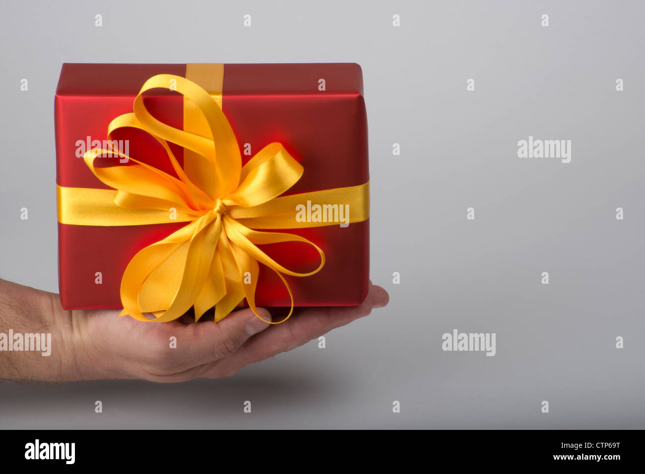 Present with gold ribbon Stock Photo