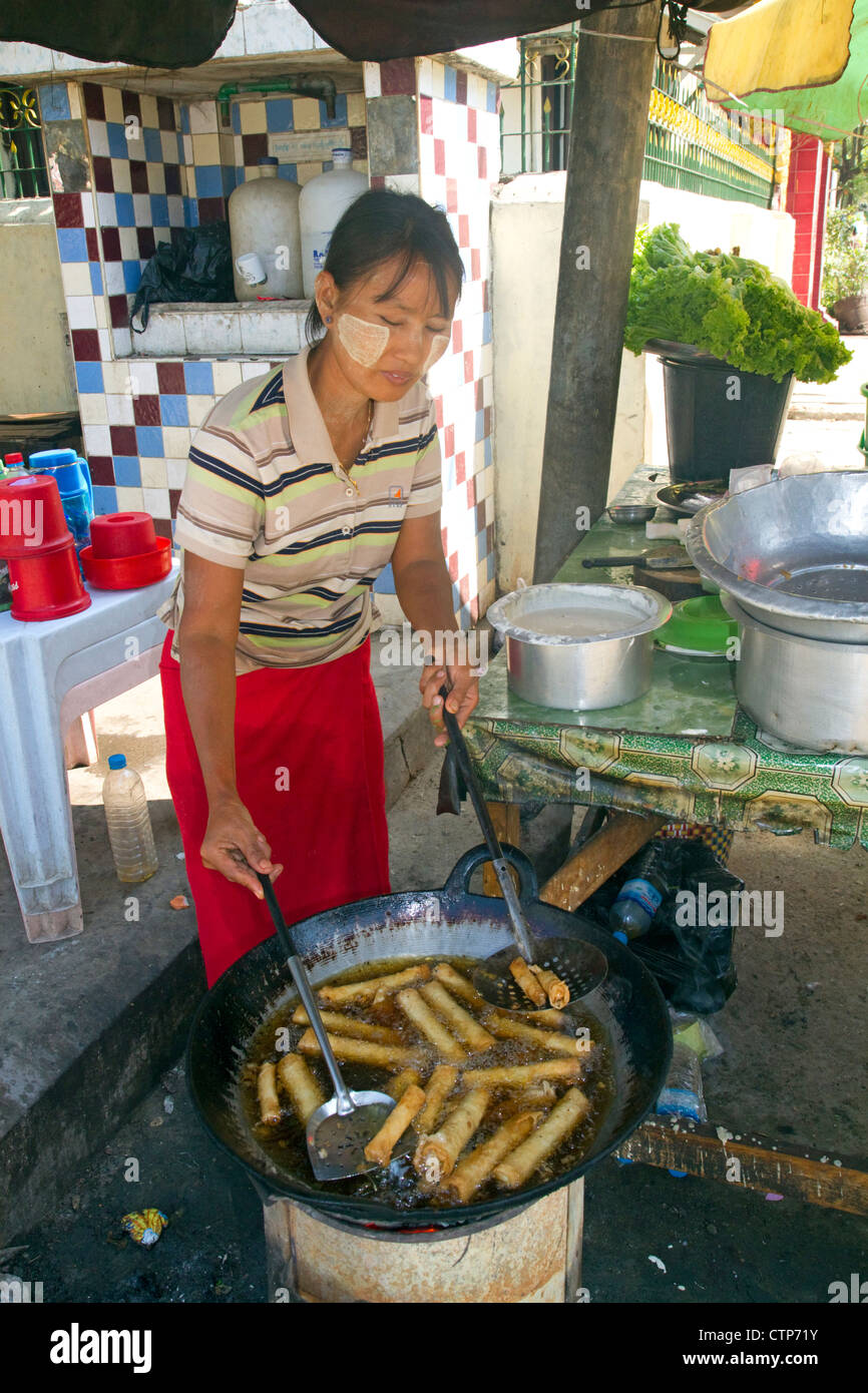 Street food vendor selling egg rolls in (Rangoon) Yangon, (Burma) Myanmar. Stock Photo