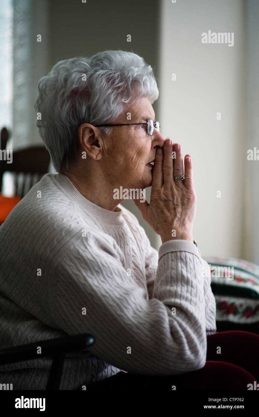 Old woman sitting in chair Stock Photo - Alamy