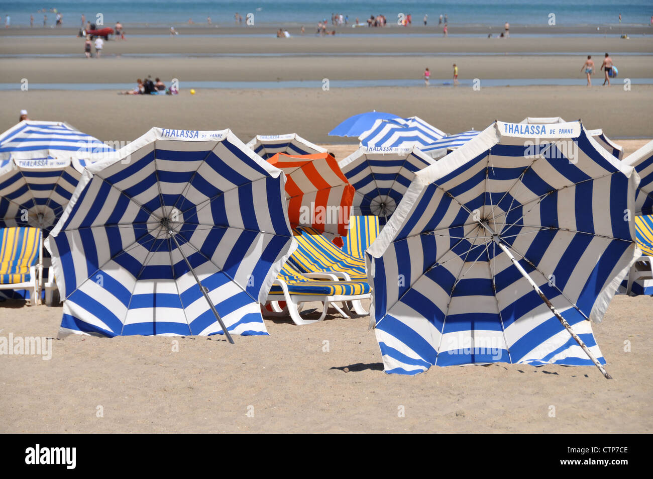 Striped parasols on the beach in De Panne, Belgium Stock Photo - Alamy
