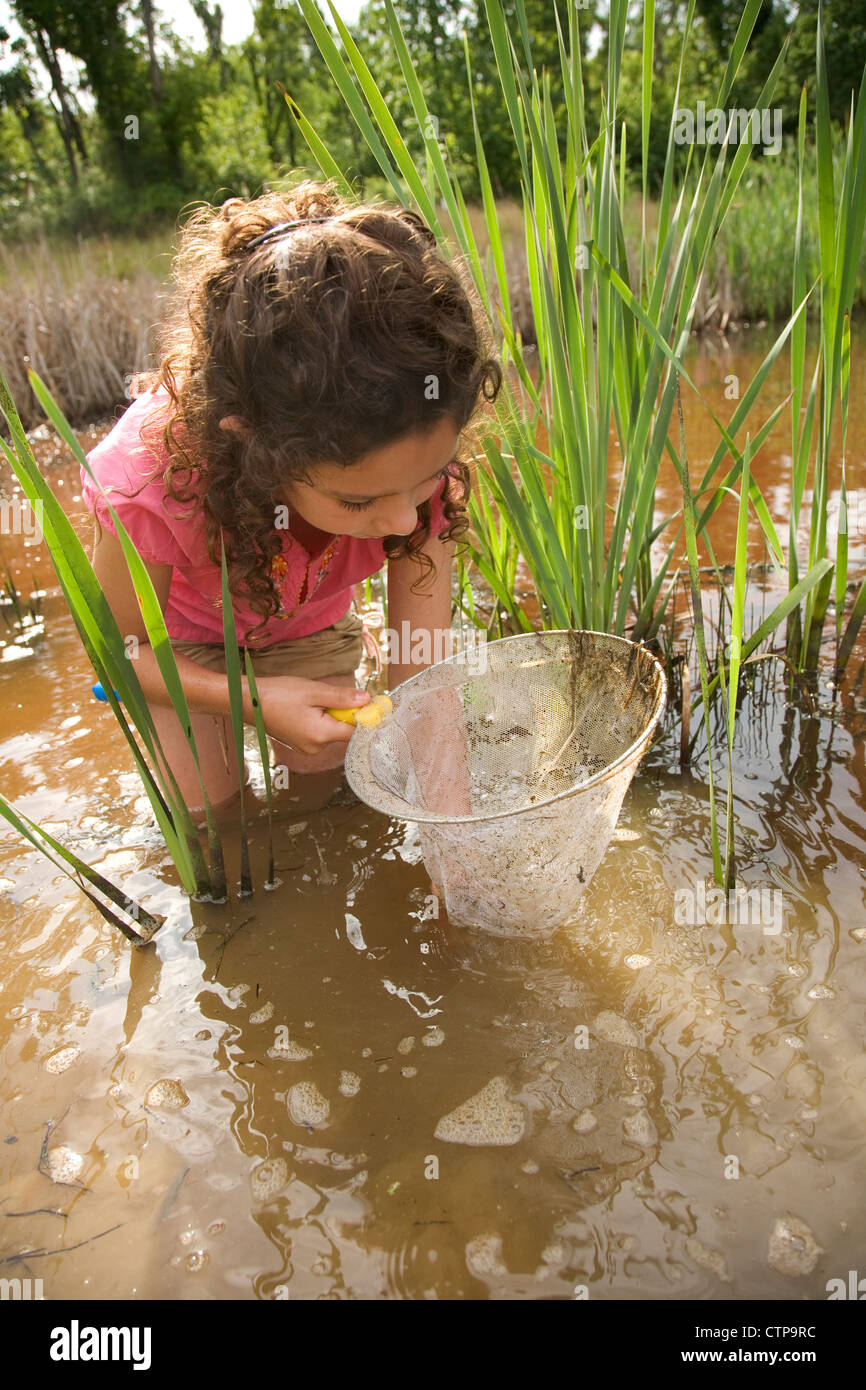 Close view of young girl exploring nature Stock Photo